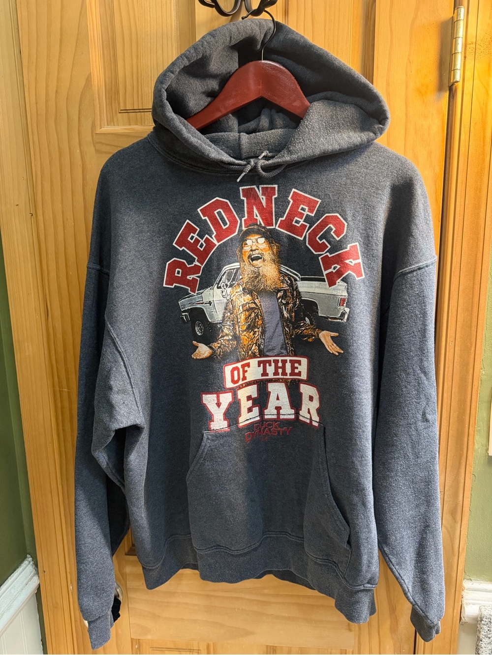 Jerzees Dark Gray Hoodie with Red and White 'Redneck of the Year' Graphic